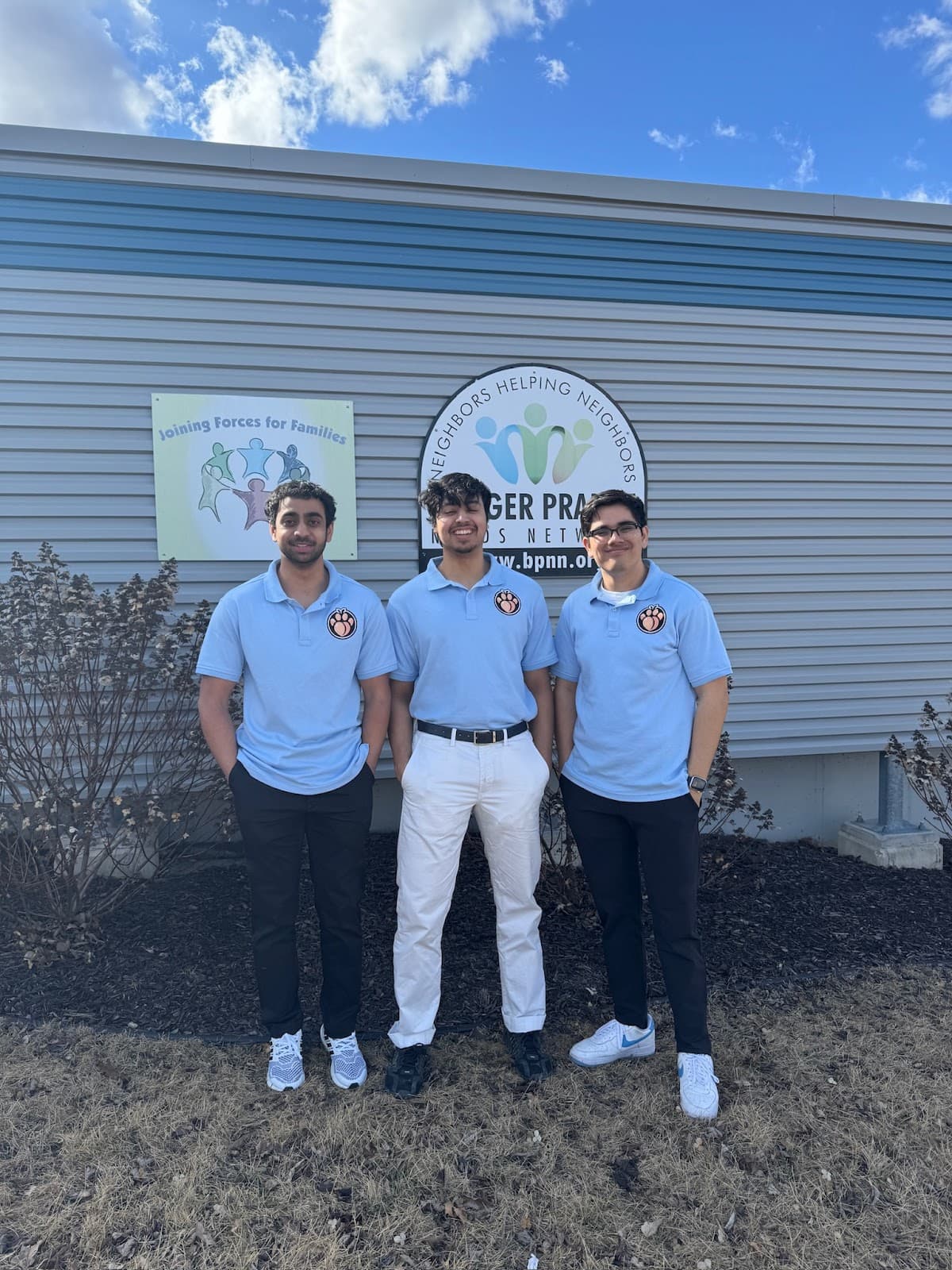 SweetBeasts Founders outside of a food pantry